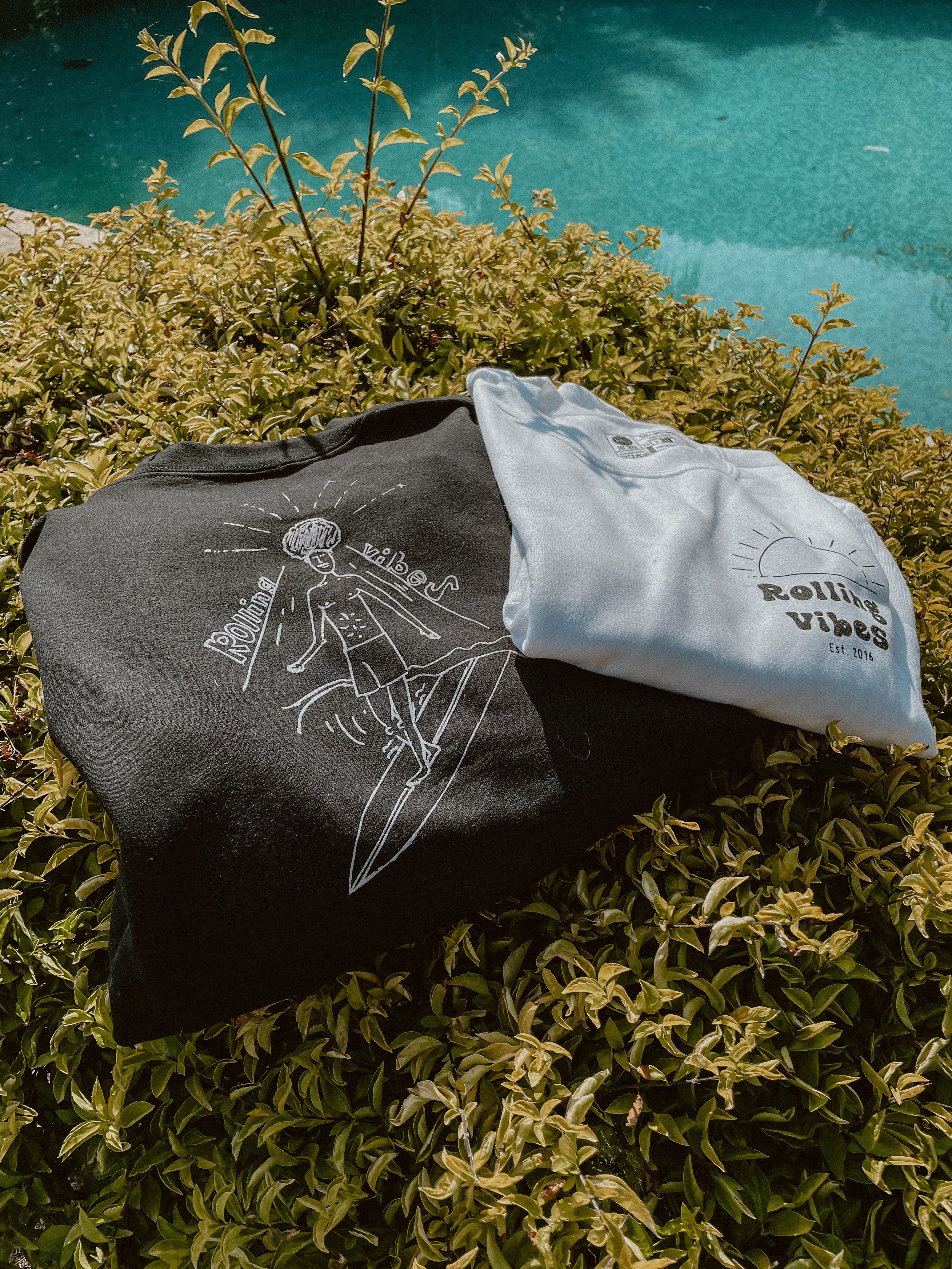 Black Rolling Vibes Pullover with a drawing of a sunrise and the text Rolling Vibes on the front: "Black Rolling Vibes Pullover with Sunrise Design