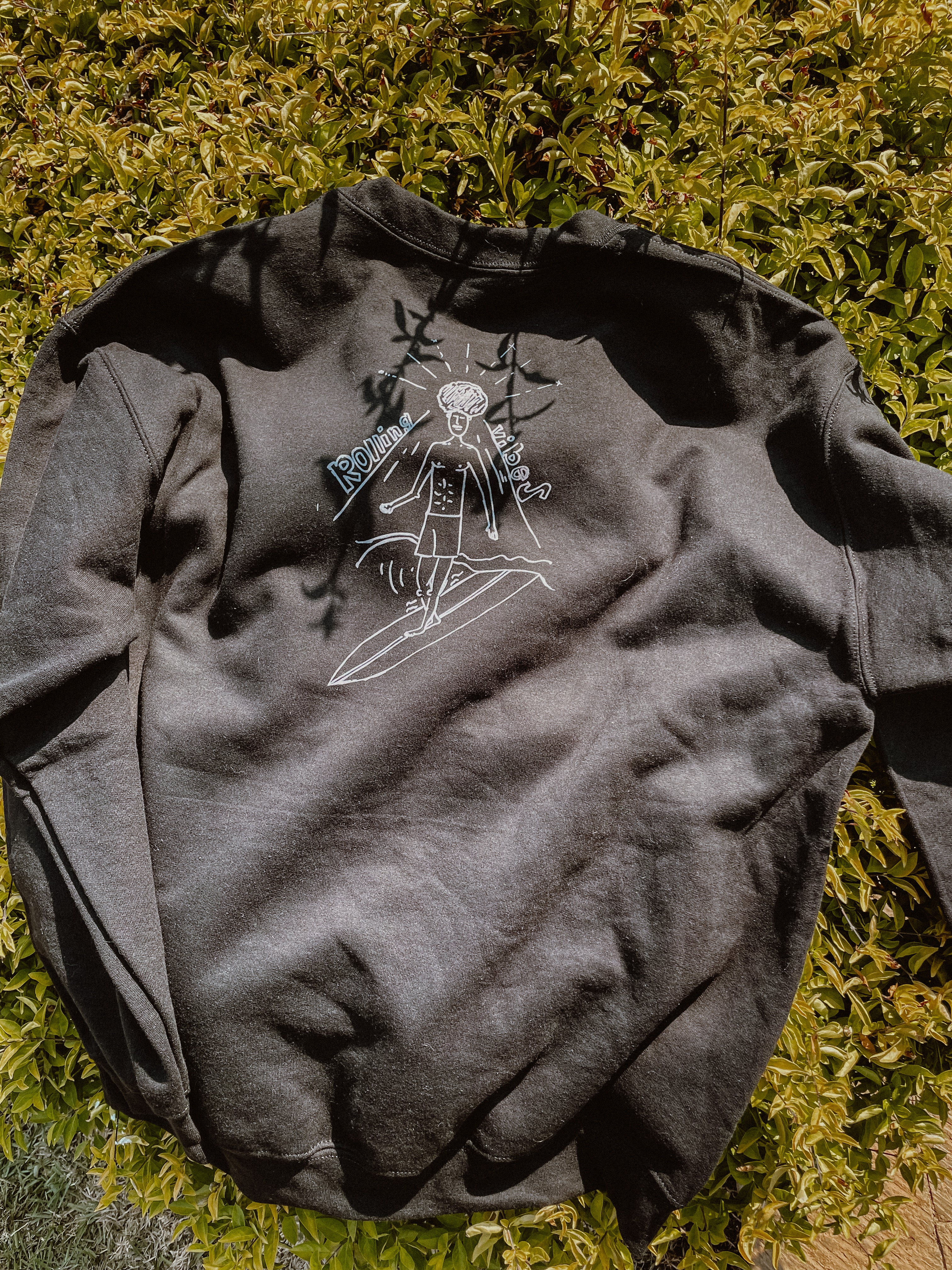 Black Rolling Vibes Pullover with a drawing of a sunrise and the text Rolling Vibes on the front: "Black Rolling Vibes Pullover with Sunrise Design