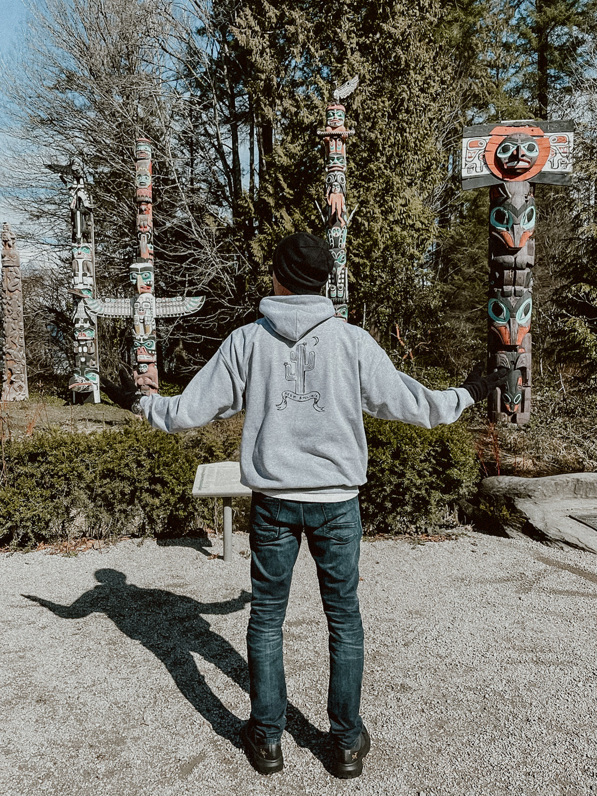 Grey Rolling Cactus Hoodie with person and cactus design on front and moon and cactus design on back