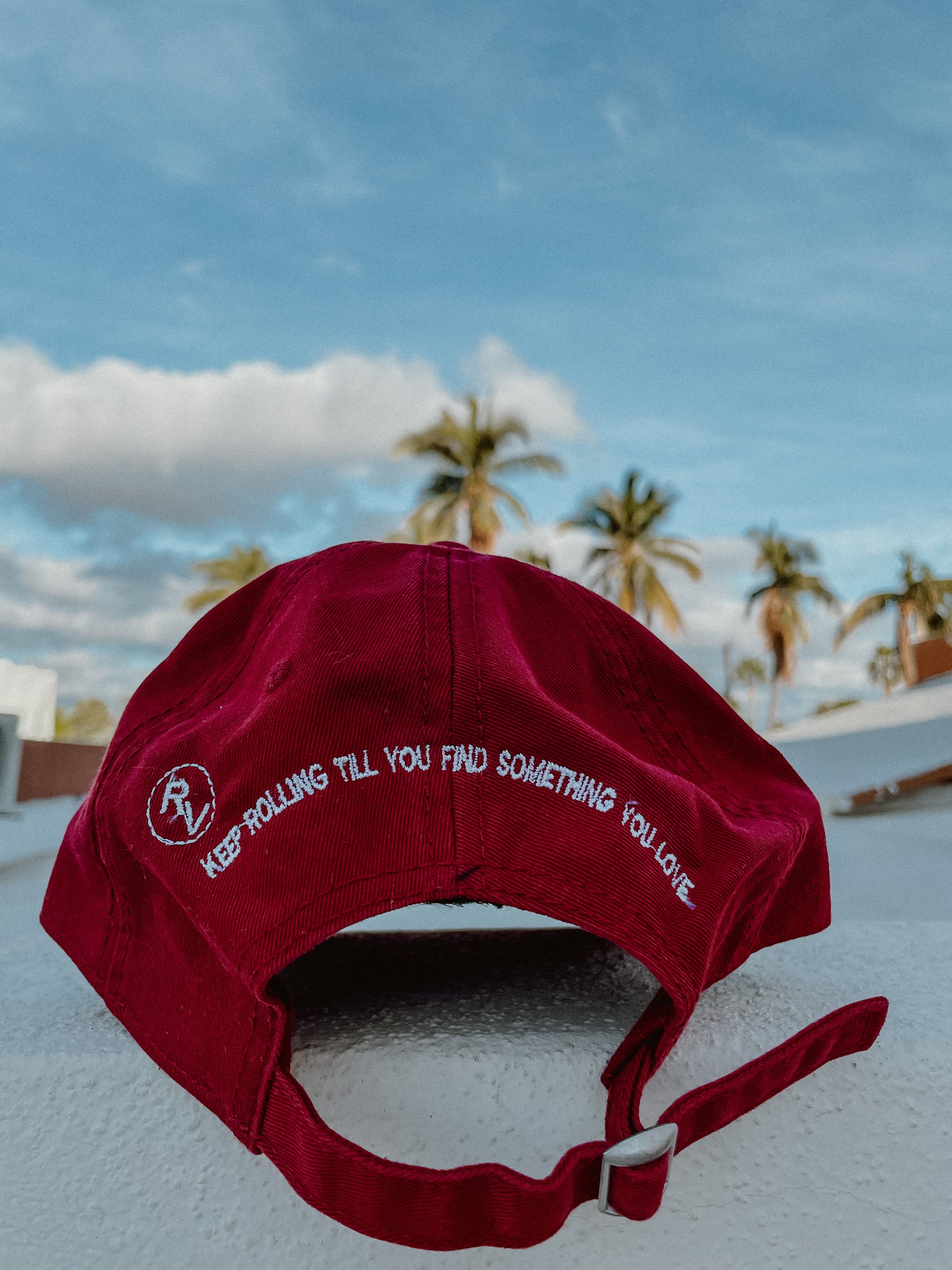 Red Rolling Hat "Dad Hat" with Rolling Vibes logo on front and "keep rolling till you find something you love" on back