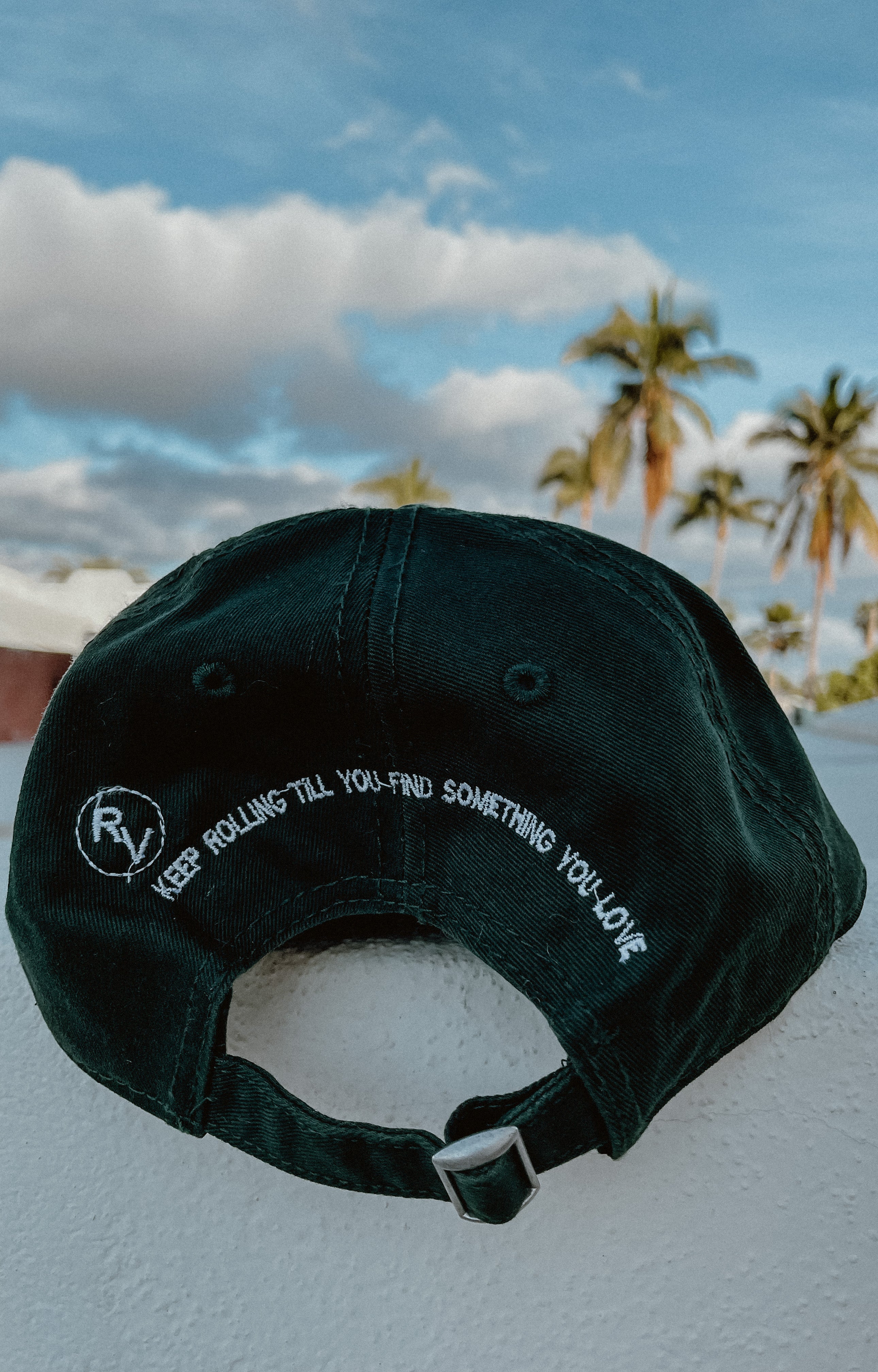 Green Rolling Hat "Dad Hat" with Rolling Vibes logo on front and "keep rolling till you find something you love" on back.