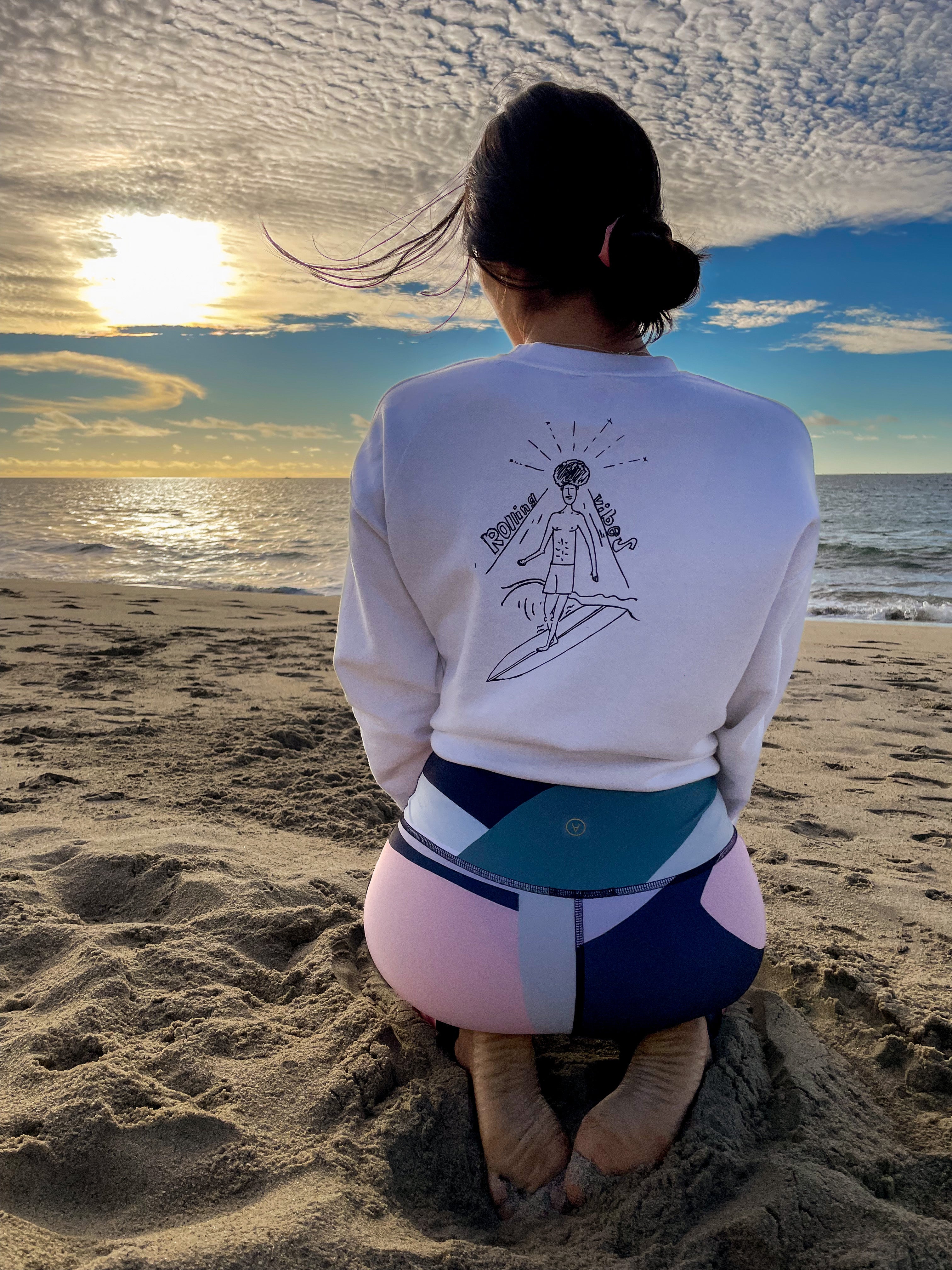 White Rolling Vibes Pullover with a drawing of a surfer with an afro on the back: "White Rolling Vibes Pullover with Surfer Design on Back